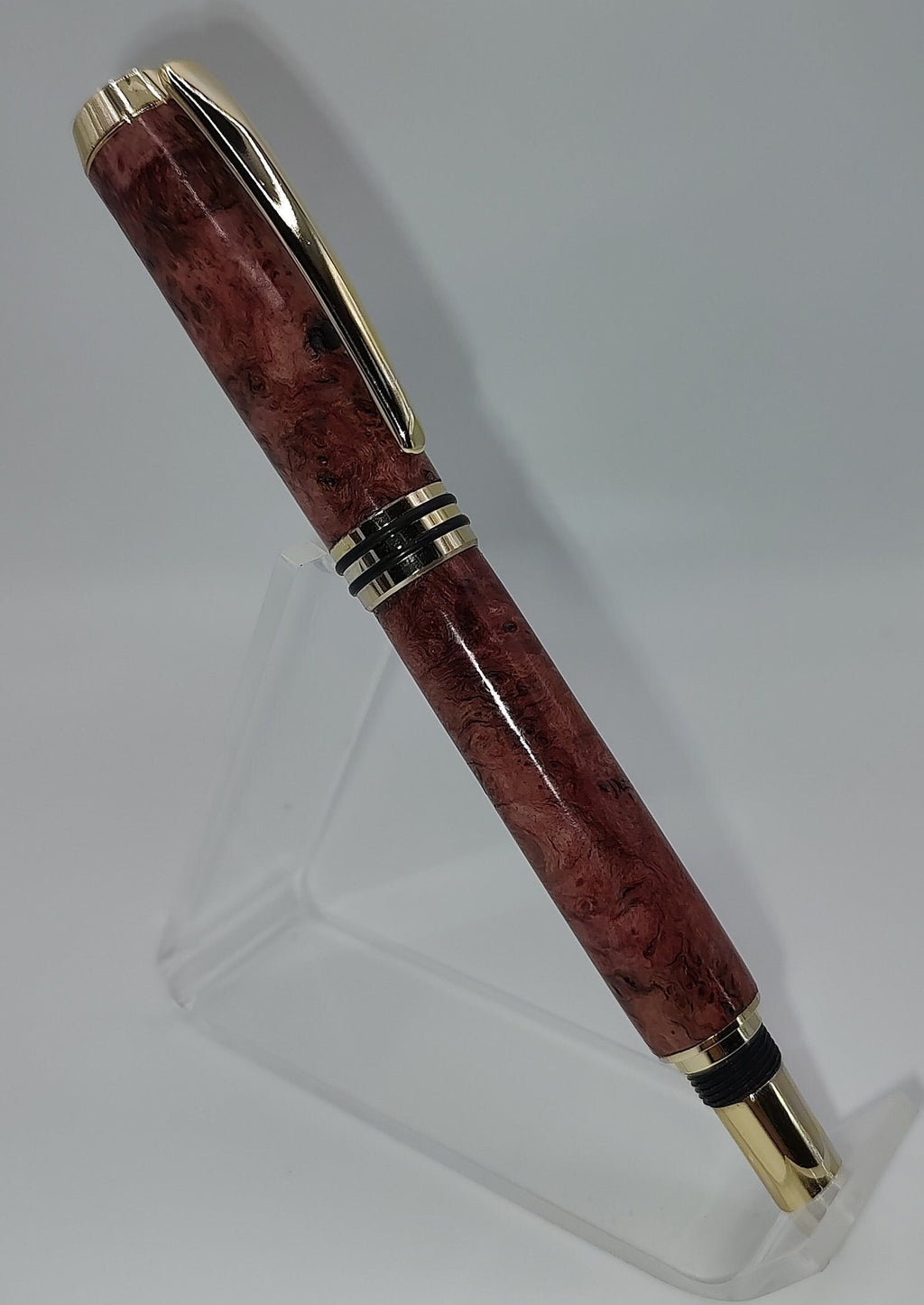 Tycoon fountain pen in red maple burl with gold and black trim