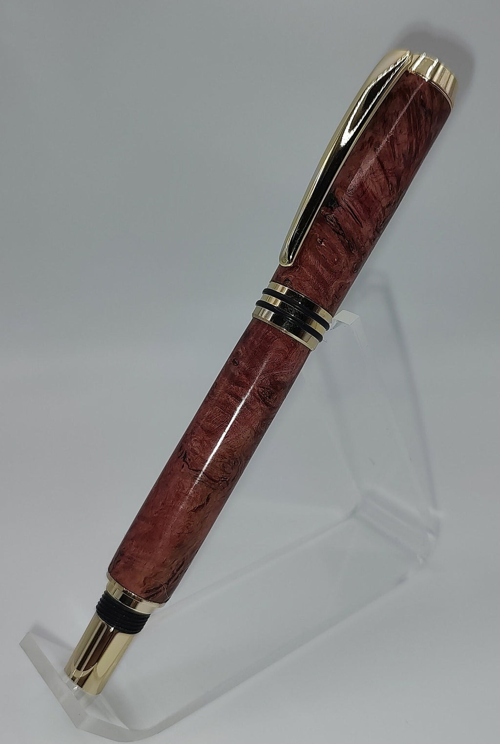 Tycoon fountain pen in red maple burl with gold and black trim