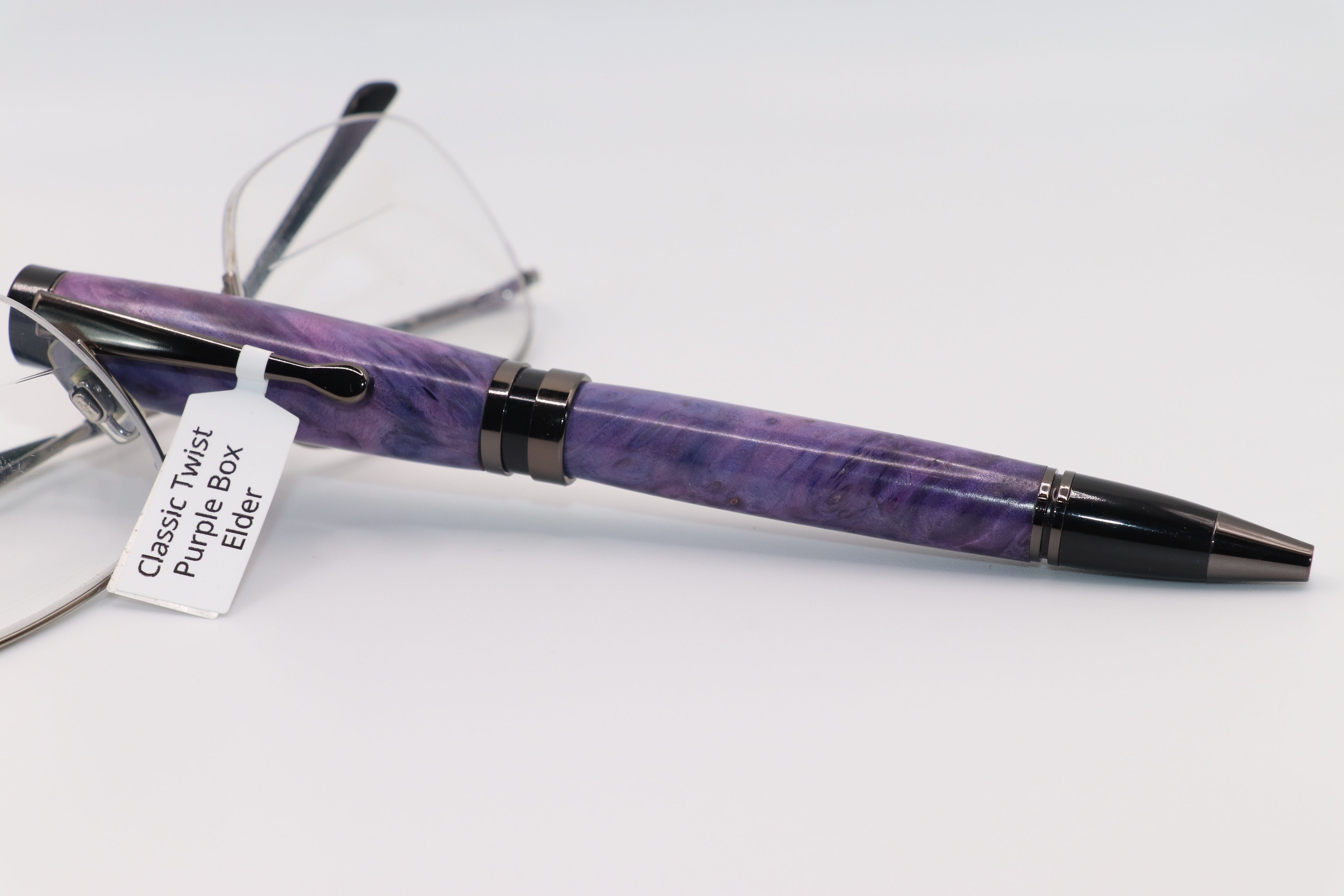Classic design twist pen in box elder dyed Purple with black and gun metal accents 
