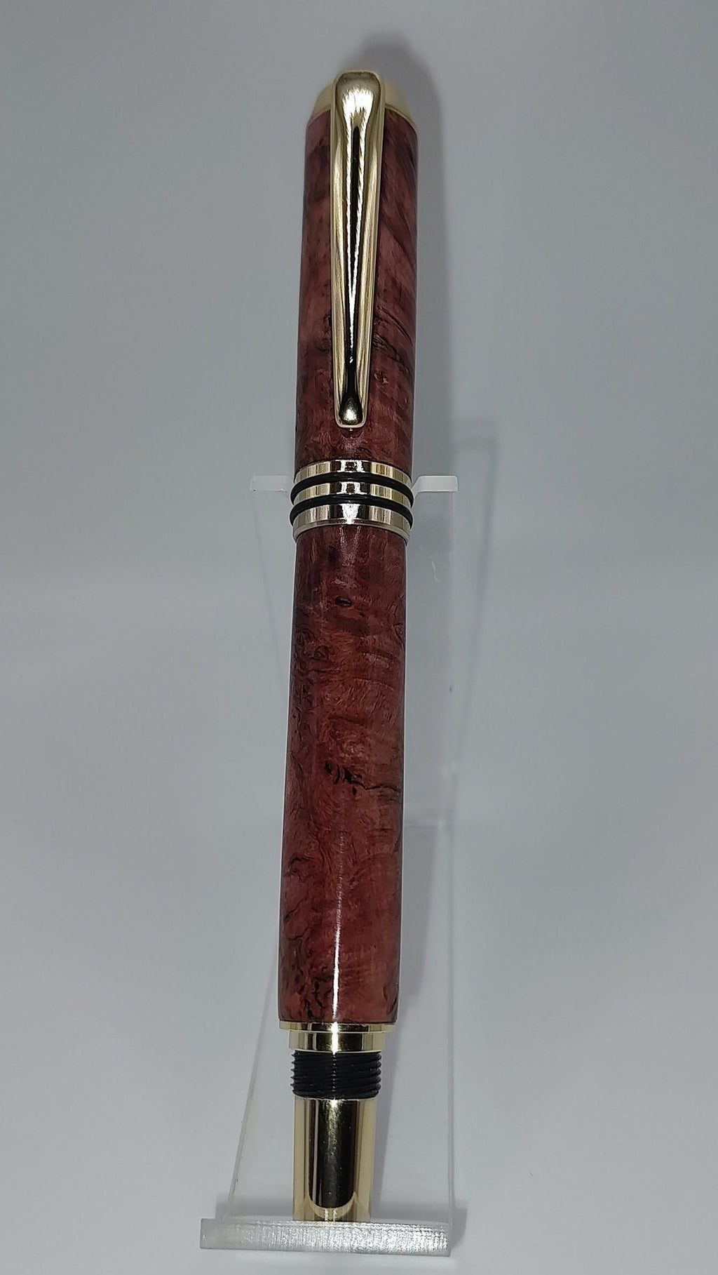 Tycoon fountain pen in red maple burl with gold and black trim